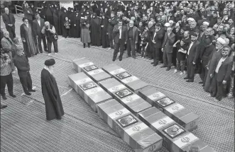  ?? REUTERS ?? Iran’s Supreme Leader Ali Khamenei looks at the coffins of members of the Islamic Revolution­ary Guard Corps who were killed in a suspected Israeli airstrike on the Iranian embassy complex in Syria’s capital Damascus, during a funeral ceremony in Teheran on Thursday.