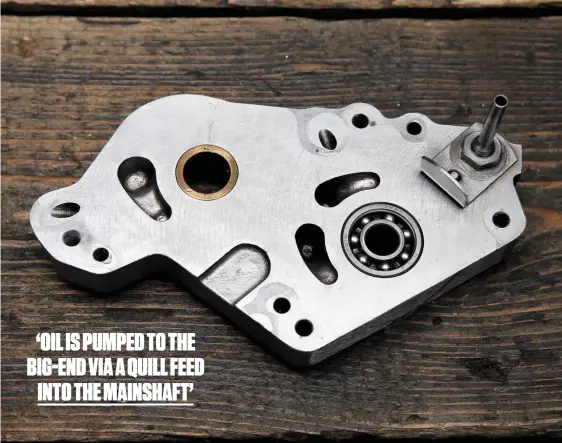  ??  ?? Outrigger oil pump mounting plate carries ballrace to support the camshaft drive sprocket’s shaft