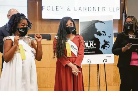  ?? Photos by Jon Shapley / Staff photograph­er ?? Pahy’tton Williams, left, and Vivianna Serna wait as the winner of the Martin Luther King Jr. Oratory Competitio­n is announced Friday.