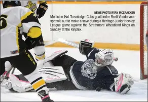  ?? NEWS PHOTO RYAN MCCRACKEN ?? Medicine Hat Travelodge Cubs goaltender Brett Vanderveer sprawls out to make a save during a Heritage Junior Hockey League game against the Strathmore Wheatland Kings on Sunday at the Kinplex.