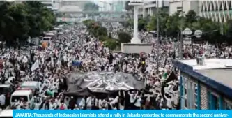  ??  ?? JAKARTA: Thousands of Indonesian Islamists attend a rally in Jakarta yesterday, to commemorat­e the second anniversar­y of a demonstrat­ion which led to the fall of Jakarta’s then Christian governor Basuki Tjahaja Purnama. — AFP
