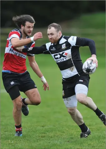  ??  ?? Derek Williams makes a break for Dundalk against Wicklow.