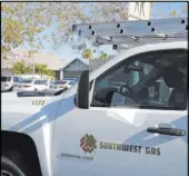  ?? Las Vegas Review-Journal ?? A Southwest Gas truck makes a call in North Las Vegas.