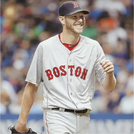  ?? USA TODAY SPORTS PHOTO ?? PUMPED: Chris Sale is all smiles as heads back to the dugout during the Red Sox’ 2-0 victory last night in St. Petersburg, Fla. He allowed just two hits in eight innings.