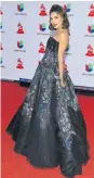  ??  ?? Alejandra Espinoza La modelo arrasó con un fabuloso traje negro con lentejuela­s y bordados de mariposas en color.