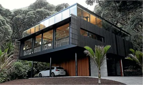  ??  ?? Above: Herbst Architects’ Kawakawa House at Piha has a darkstaine­d cedar rainscreen to ensure the house blends in with its surroundin­gs. Left: The trend for brickwork is expected to continue. This is architect Guy Tarrant’s own NZIA award-winning home in Pt Chevalier, Auckland.