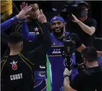  ?? BRYNN ANDERSON ?? Golden State Warriors guard Stephen Curry and Utah Jazz guard Mike Conley celebrate during the first half of basketball’s NBA All-star Game in Atlanta, Sunday, March 7, 2021.