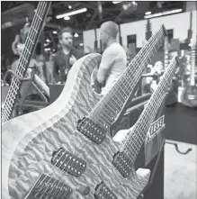  ??  ?? KIESEL GUITARS, formerly Carvin of San Diego, now devotes itself to crafting custom creations such as this double-neck ax.