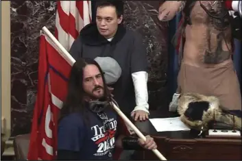  ?? U.S. CAPITOL POLICE VIA AP ?? In this file image from US Capitol Police video, Paul Allard Hodgkins, 38, of Tampa, Fla. (front) stands in the well on the floor of the US Senate on Jan. 6 at the Capitol in Washington.