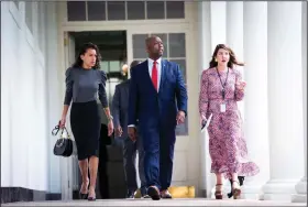 ?? (The New York Times/Doug Mills) ?? Sen. Tim Scott, R-S.C., who is leading GOP efforts on law enforcemen­t issues, arrives Tuesday at the White House ceremony for President Donald Trump’s executive order on police measures.