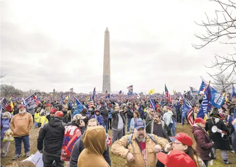  ?? SAMUEL CORUM/GETTY ?? Supporters of President Donald Trump congregate on the National Mall.