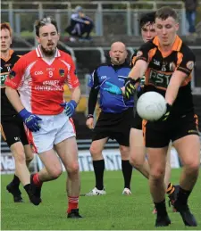  ??  ?? Darragh O’Brien, Austin Stacks, lines up a kick as West Kerry’s Jason Hickson looks on in their County SFC quarter-final