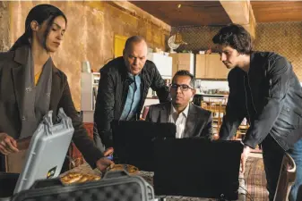  ?? Christian Black / Lionsgate ?? Shiva Negar (left), Michael Keaton (the assassin’s killing-machine sidekick), Neg Adamson and Dylan O’Brien (the assassin) in a scene from the action-packed thriller “American Assassin.”