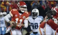  ?? ED ZURGA — ASSOCIATED PRESS ?? Quarterbac­k Alex Smith carries the ball during the Chiefs’ wild-card playoff game loss Jan. 6 to the Titans.