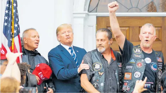  ?? Photo / AP ?? US President Donald Trump with members of Bikers for Trump.