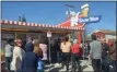  ??  ?? Snowman Ice Cream always attracts a large crowd on its opening day.