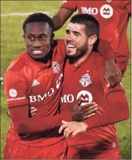  ?? Jessica Hill / Associated Press ?? Toronto FC’s Richie Laryea, left, and Alejandro Pozuelo celebrate Pozuelo’s goal during the second half of an MLS match against Inter Miami Sunday in East Hartford.