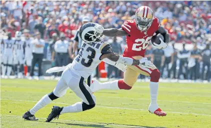  ?? AP ?? San Francisco’s Tevin Coleman, right, runs past the Rams’ John Johnson to score a touchdown in Los Angeles.