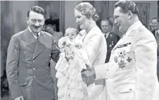  ??  ?? Edda Goering at her christenin­g in Berlin with her parents and Hitler, 1938; on her way to school in Munich, 1950; in 1986