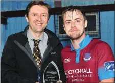  ??  ?? Ryan McEvoy receives the Drogheda Independen­t Man of the Match Award from Marcus Cavaroli.