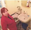  ?? OREN DORELL, USA TODAY ?? Svetlana Borispolet­s, 75, has been heating water for baths on the stove since June because Ukraine shut off the heating stations.
