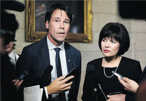  ?? THE CANADIAN PRESS / JUSTIN TANG ?? Minister of Health Ginette Petitpas Taylor stands with Eric Hoskins, former Ontario Minister of Health, after the tabling of the budget in the House of Commons on Parliament Hill on Tuesday. Hoskins will chair a federal government advisory council to...