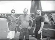  ?? Christina House Los Angeles Times ?? JIM BECHLER, center, burned to death after his R44 hit an overhang on takeoff and crashed in 2012.