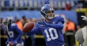  ?? SETH WENIG ?? New York Giants quarterbac­k Eli Manning (10) warms up before an NFL football game against the Miami Dolphins, Sunday, Dec. 15, 2019, in East Rutherford, N.J.