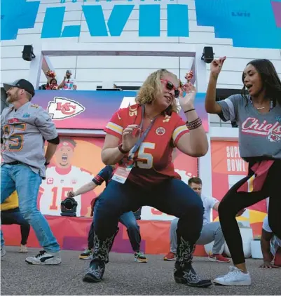  ?? SETH WENIG/AP ?? Fans dance before the Super Bowl on Sunday in Glendale, Arizona. There were no COVID restrictio­ns during this year’s festivitie­s.