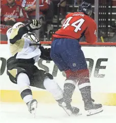  ?? PABLO MARTINEZ MONSIVAIS, AP ?? The Capitals’ Brooks Orpik levels the Penguins’ Olli Maatta in Game 2, earning a three-game suspension.