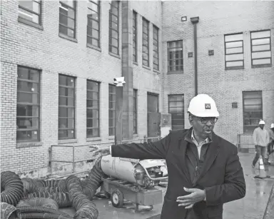  ?? THE COMMERCIAL APPEAL ?? Jimmie Tucker guides a tour of the renovation to the Universal Life Insurance building March 16. BRAD VEST /