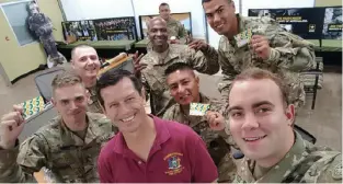  ??  ?? In Riverside, California, Tommy Maher (wearing red) treated one Army recruiting station to a meal from Subway, in honor of Las Vegas shooting victim Angela Gomez.