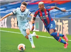  ??  ?? Race is on: Chelsea’s Billy Gilmour (left) and Crystal Palace’s Patrick van Aanholt battle for the ball