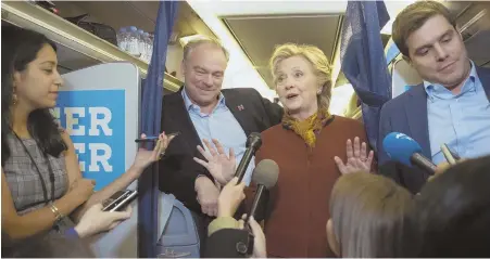  ?? AP FILE PHOTO ?? ‘PRETTY WEAK’: Members of the media traveling with Democratic presidenti­al candidate Hillary Clinton gather around the candidate and her vice presidenti­al pick, U.S. Sen. Tim Kaine, aboard the campaign jet. The media’s performanc­e during this year’s...