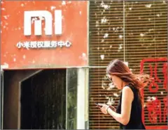  ?? AFP ?? Xiaomi’s smart electric-vehicle (EV) business would operate under a wholly-owned subsidiary with an initial investment of 10 billion yuan ($1.5 billion).