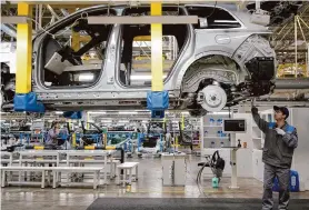  ?? Chinatopix/Associated Press ?? A worker assembles an SUV in March at a manufactur­ing plant of Li Auto in Changzhou, China. The U.S. announced new tariffs on Chinese EVs on Tuesday.