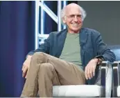  ?? FREDERICK M. BROWN/GETTY 2017 ?? Larry David has a signature style — an amalgam of longsleeve polo shirts, tan trousers, nondescrip­t hoodies, blazers and sneakers.