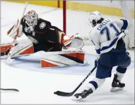  ?? KYUSUNG GONG — THE ASSOCIATED PRESS ?? Tampa Bay's Anthony Cirelli takes aim for the game-winning goal in overtime against the Ducks' Lukáš Dostál in Sunday's game at Honda Center.