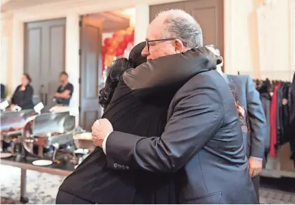  ?? BAYADA HOME HEALTH CARE ?? Mark Baiada, founder of Bayada Home Health Care, shares a hug with an employee at a luncheon in Philadelph­ia.