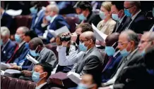  ?? FENG YONGBIN / CHINA DAILY ?? Foreign diplomats attend the opening ceremony of the third session of the 13th National People’s Congress in the Great Hall of the People in Beijing on Friday.