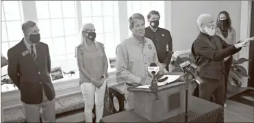  ?? Michael Holahan/The Augusta Chronicle via AP ?? Gov. Brian Kemp speaks in Augusta during a stop on his fly-around tour to encourage Georgians to stop the spread of COVID-19 on Friday.