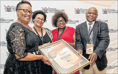  ?? Picture: MARK WEST ?? SERVICE EXCELLENCE: At the awards ceremony, are, from left, Social Developmen­t MEC Nancy Sihlwayi, Amathole district mayor Nomfusi Nxawe, special award winner Nomatemba Gunguluza, of Unobandla Early Childhood Developmen­t Centre in Port Elizabeth, and...