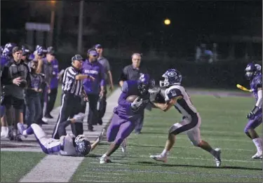  ?? Terrance Armstard/News-Times ?? Tough night: El Dorado's Shun Levingston is shoved out of bounds after a long run against Greenwood. The play was called back by a flag. The Bulldogs beat the Wildcats 44-27 Friday at Memorial Stadium.