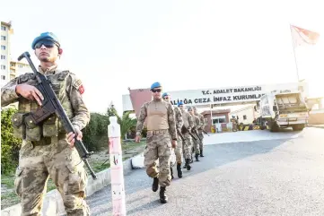  ??  ?? Turkish security officers patrol in front Aliaga court house at Aliaga in Izmir. — AFP photos