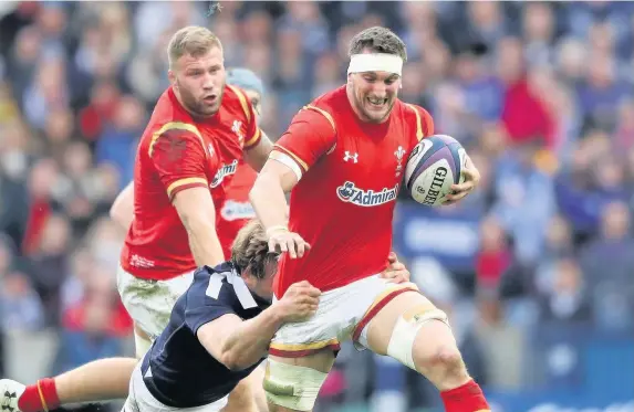  ??  ?? > Sam Warburton the thick of the action during the Six Nations clash against Scotland in March. He’s now on course to be fit for this year’s tournament