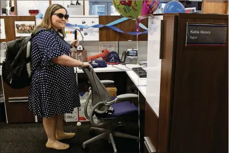  ??  ?? Katie arrives at her job with the Atlanta Braves’ social media department at SunTrust Park.