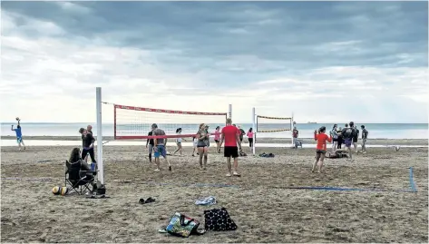  ?? BOB TYMCZYSZYN/STANDARD STAFF ?? Several volleyball courts were set up Tuesday at Sunset Beach. Citizens who opposed a previous proposal to use Sunset Beach for a beach volleyball group are upset the city has moved other groups there from Lakeside Beach due to the fact the Port Dalhousie site is unusable because of high Lake Ontario water levels.