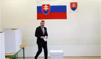  ?? ?? Le candidat Peter Pellegrini, actuelleme­nt président du Parlement, se prépare à voter lors du premier tour de la présidenti­elle à Bratislava, en Slovaquie, samedi 23 mars 2024