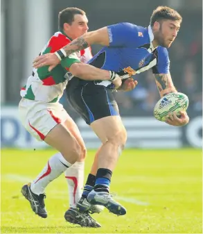  ?? PICTURE: Stu Forster/getty Images ?? Matt Banahan is tackled by Biarritz’s Michael Bond during their 2010 Heineken Cup opener