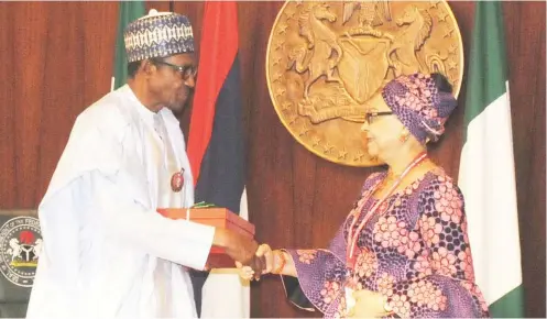  ?? Photo Felix Onigbinde ?? President Muhammadu Buhari receives the report of the Tripartite Committee on the National Minimum Wage from the committee’s Chairman, Ms. Ama Pepple, at the Presidenti­al Villa in Abuja yesterday